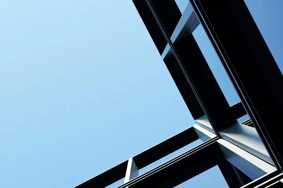 Close up of a metal structure with a blue sky in the background